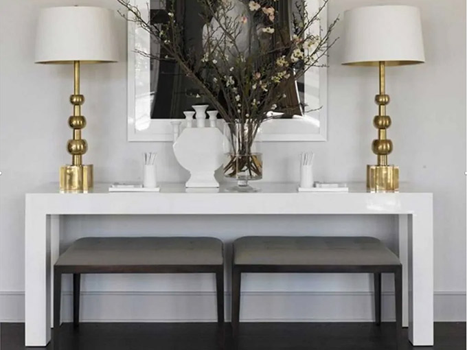 lamps and white table next to wall